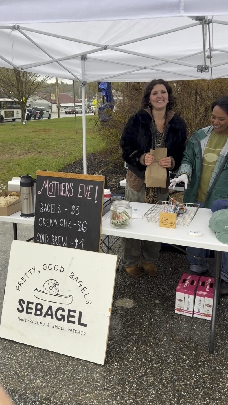 Sebagel hand-rolled bagels booth set up for Mother's Eve in Naples