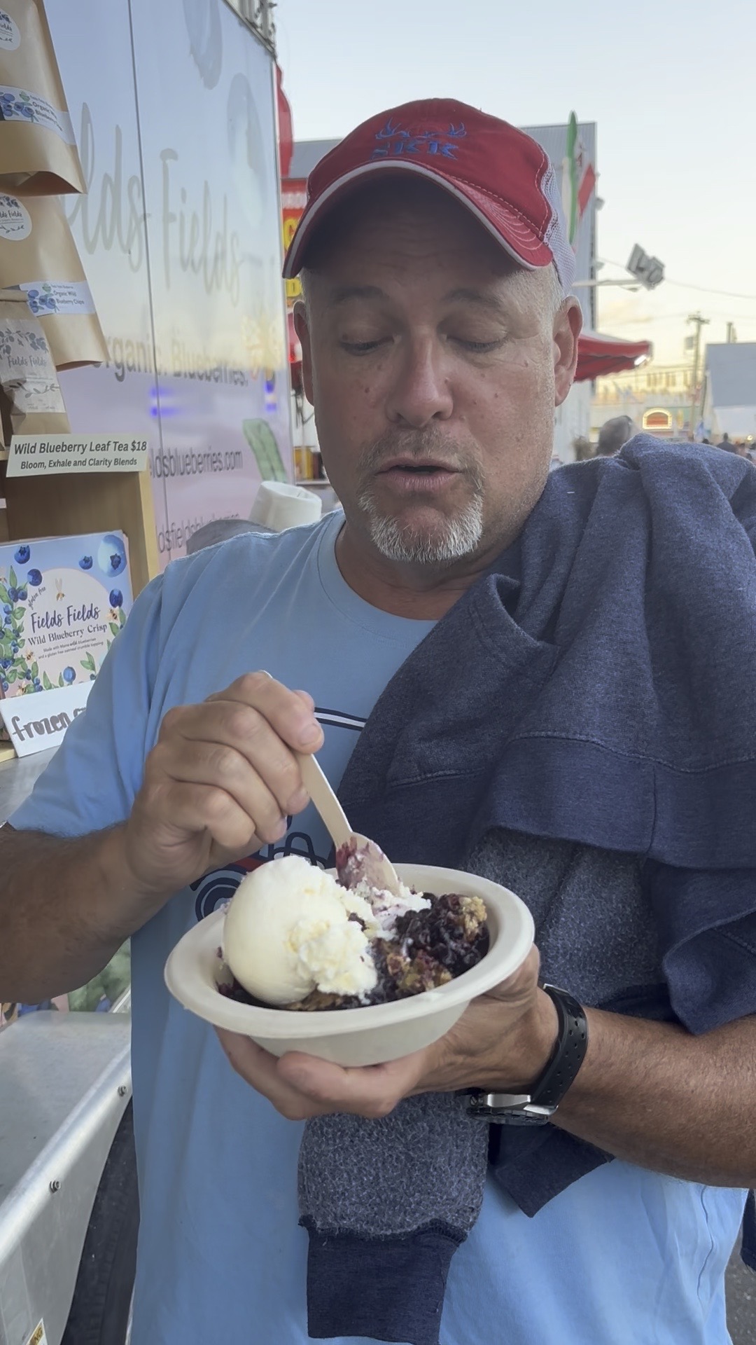 Enjoying blueberry crisp with vanilla ice cream at the Fryeburg Fair