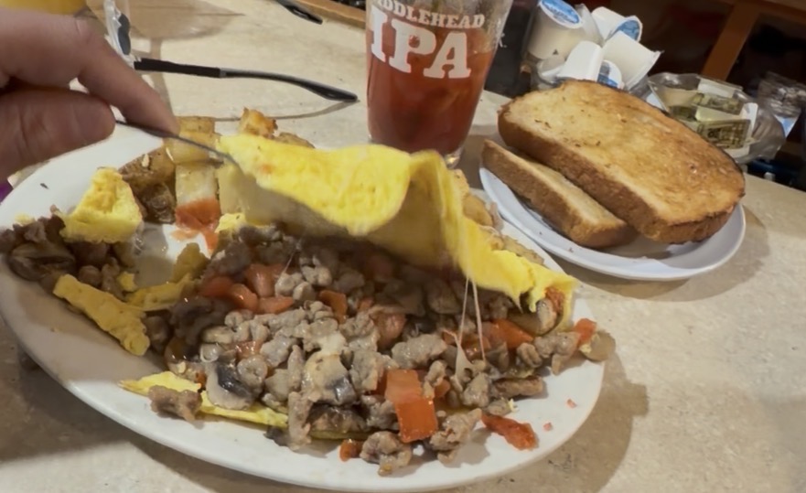 Sausage mushroom and pepper hash with eggs and toast at Kelley's Sebago Diner