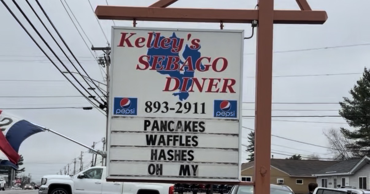 Kelley's Sebago Diner roadside sign in Windham, Maine reading Pancakes, Waffles, Hashes, Oh My