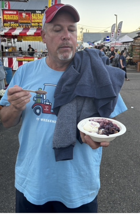 Eating a blueberry crisp with vanilla ice cream at the Fryeburg Fair