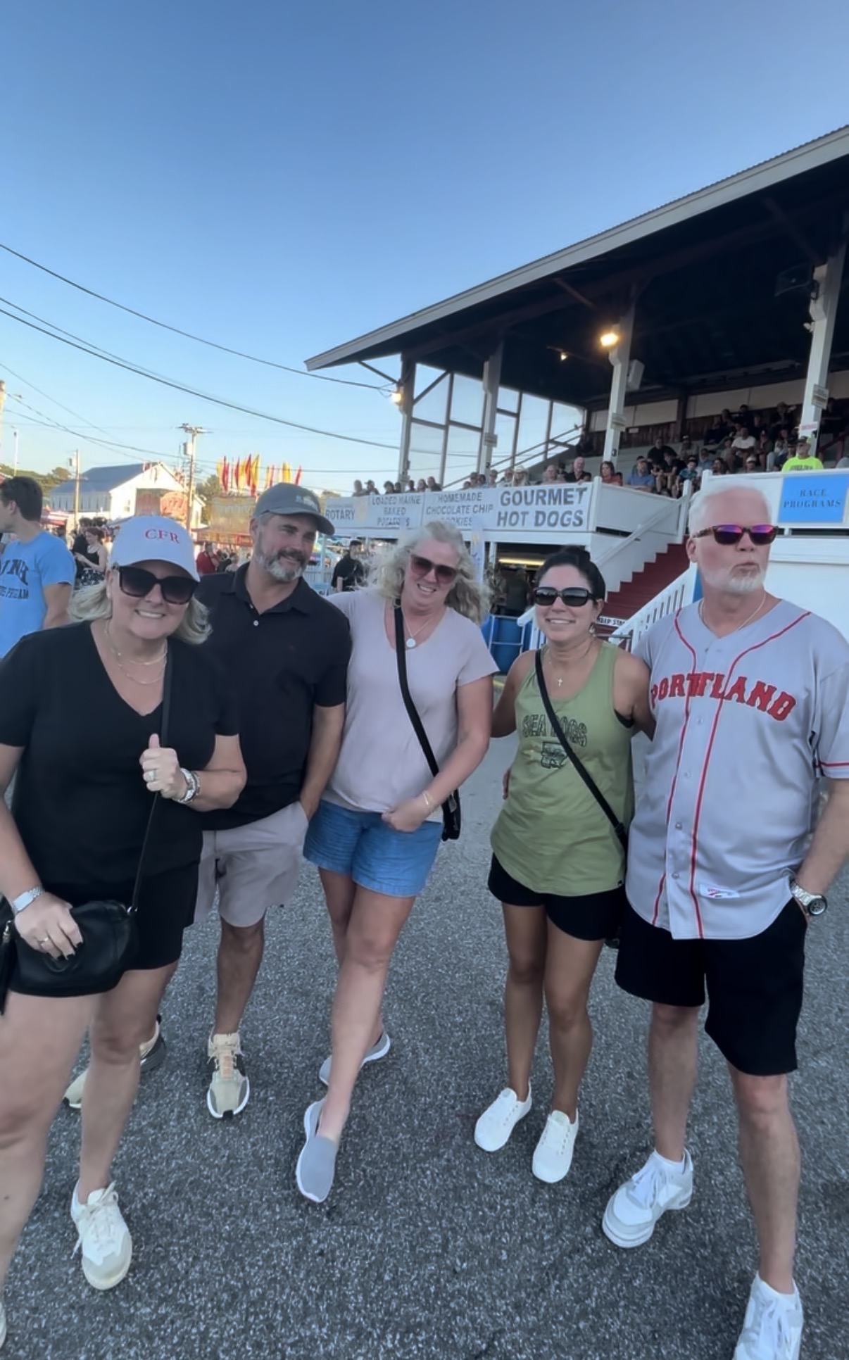 Friends gathered near the grandstand at the Fryeburg Fair before the pulls