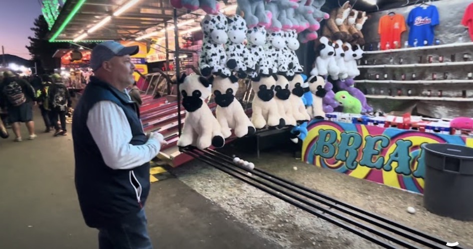 Playing games on the midway at the Fryeburg Fair at dusk