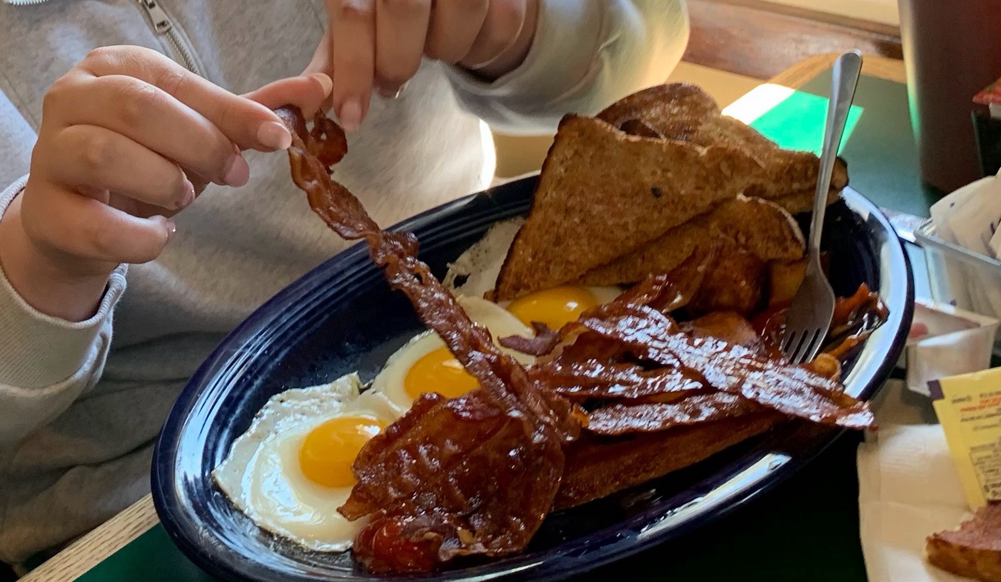 Bacon and eggs breakfast plate at Top of the Hill Grille