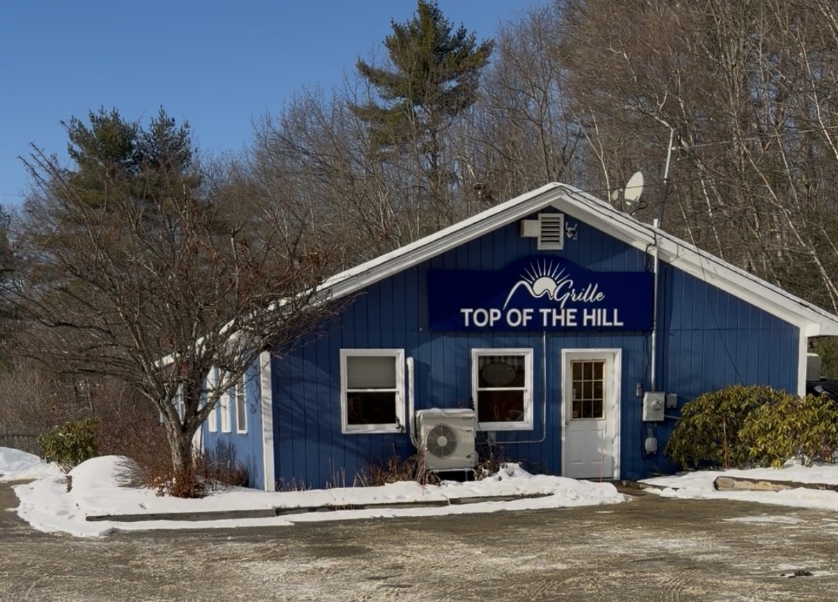 Top of the Hill Grille exterior - blue building on Route 302